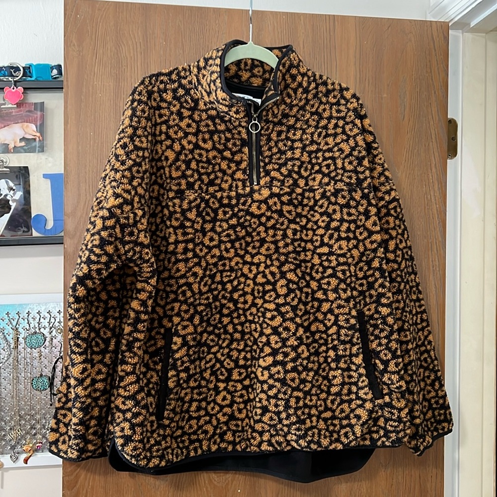 Cheetah pull over with a sweater style pocket on the front